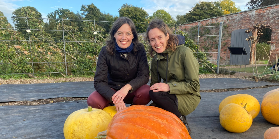 Sarah Rozenthuler and Ems with a pumpkin living your best life